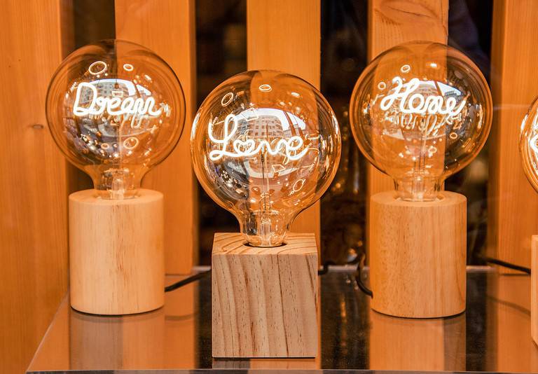 Creative light bulbs with inspirational words inside